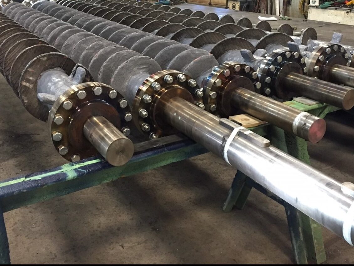 Industrial Solutions biomass feed screws fabricated in Brewer, Maine